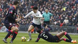 Son on the double as Spurs coast past Huddersfield