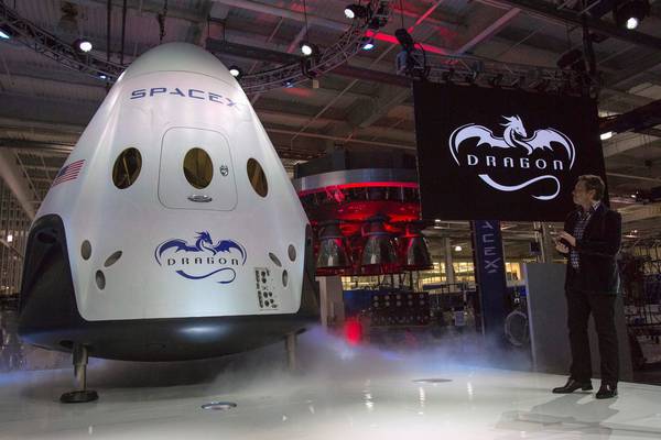 SpaceX to send first tourists around the moon next year