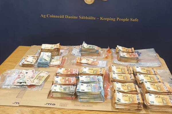 Two men charged following seizure of cars and cash