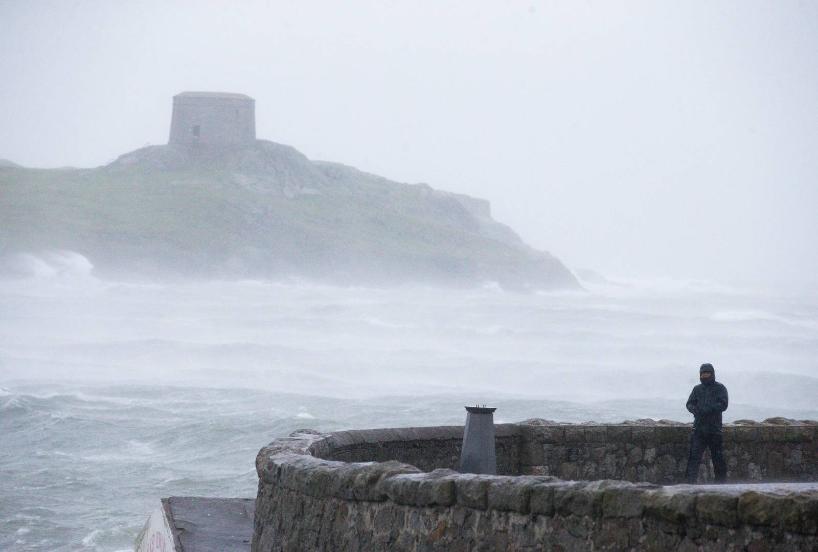 NEWS 
13/1/2020
Views of  Storm Brendan.
A man is pictured  at  Coliemore Harbour Dalkey, Co. Dublin
Photo: Tom Honan for The Irish Times.