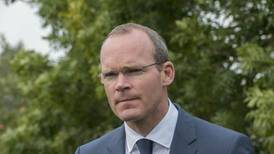 Coveney moves to dampen speculation about early election