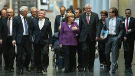 Irish debt linked to Angela Merkel talks on coalition