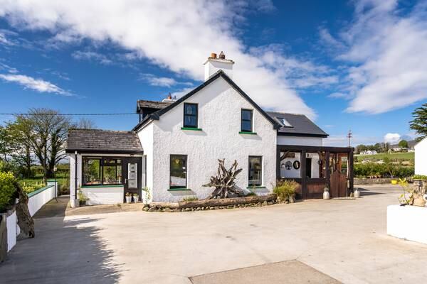 Quaint period home at the edge of Lough Foyle with eco glamping business for €365,000