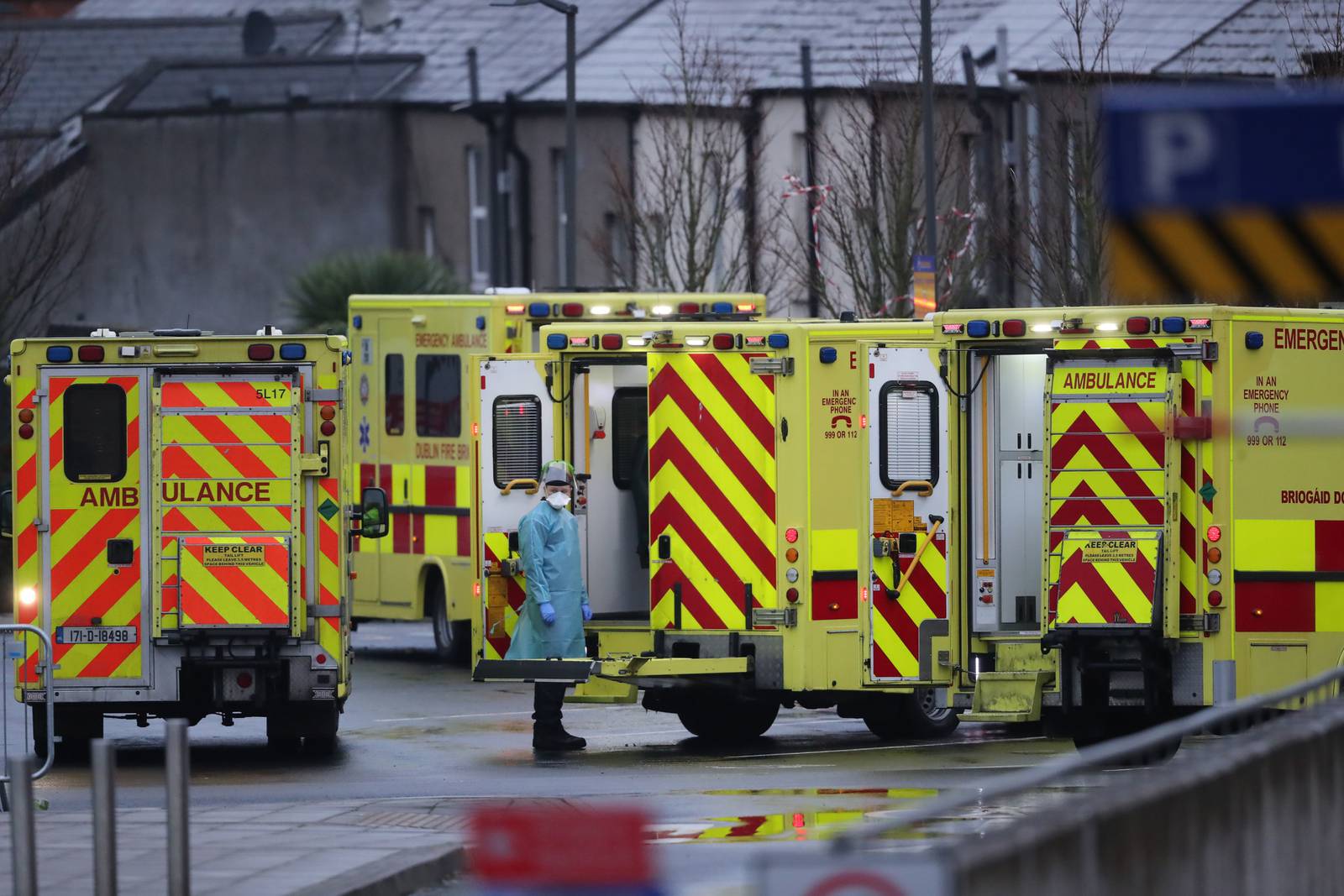 A medic in PPE and ambulances outside the Accident and Emergency department at the Mater Hospital in Dublin. Deputy chief medical officer Dr Ronan Glynn has warned significant levels of Covid-19 mortality lie ahead for Ireland and "hospitals are under intense pressure". Picture date: Monday January 18, 2021. PA Photo. See PA story IRISH Coronavirus. Photo credit should read: Niall Carson/PA Wire