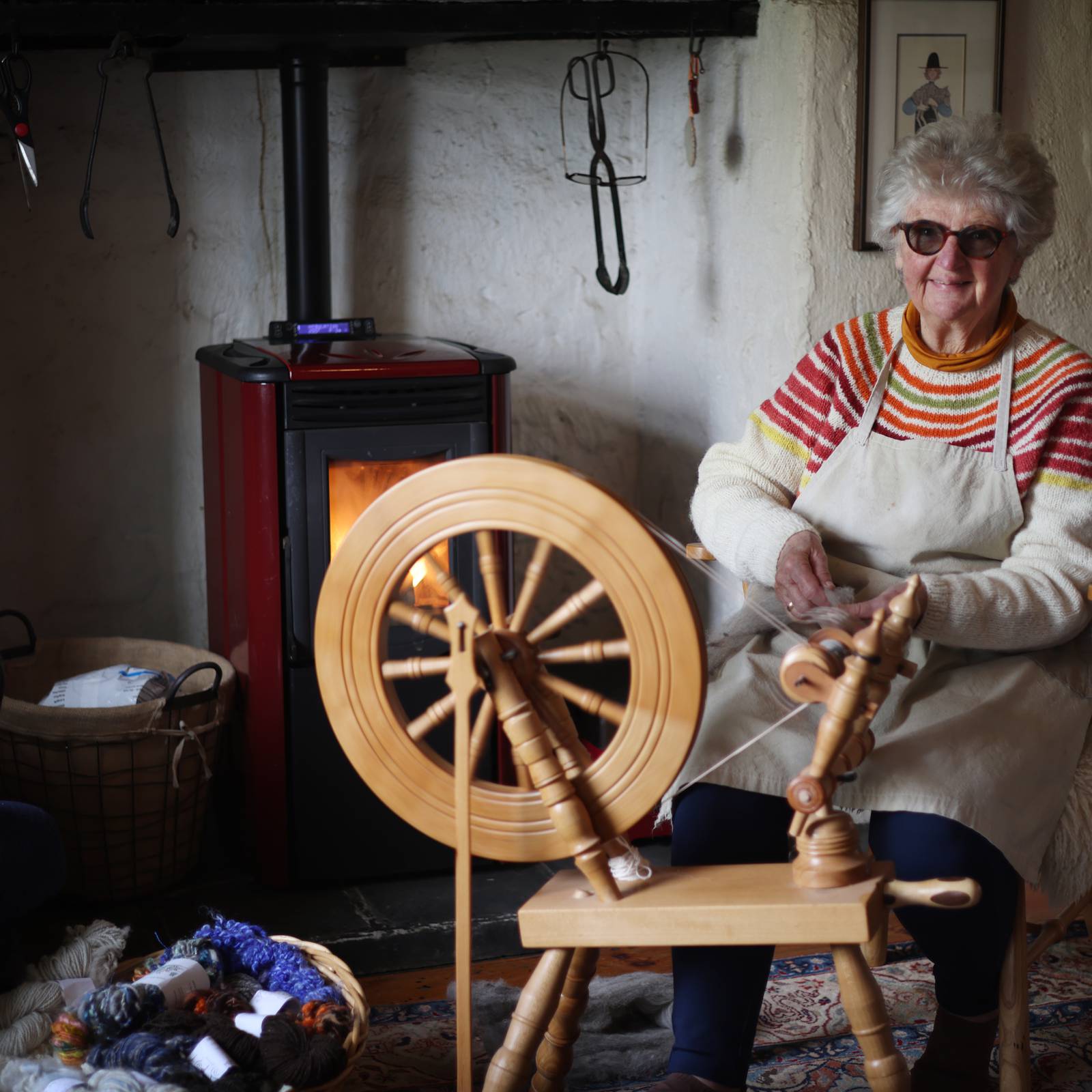 This Woman In Action Is Making Homemade Yarn With A Spinning Wheel