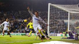 Kemar Roofe’s late double extends Leeds’ advantage at the top