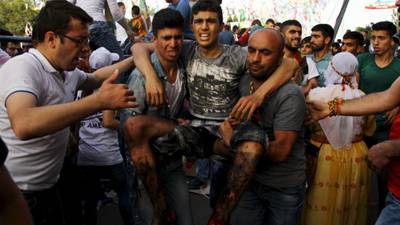 Two dead and 100 hurt in blasts at Kurdish rally in Turkey