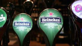 Heineken lowers margin growth target, citing volatile markets