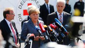 Angela Merkel condemns “hate” towards asylum seekers