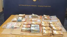 Two men charged following seizure of cars and cash