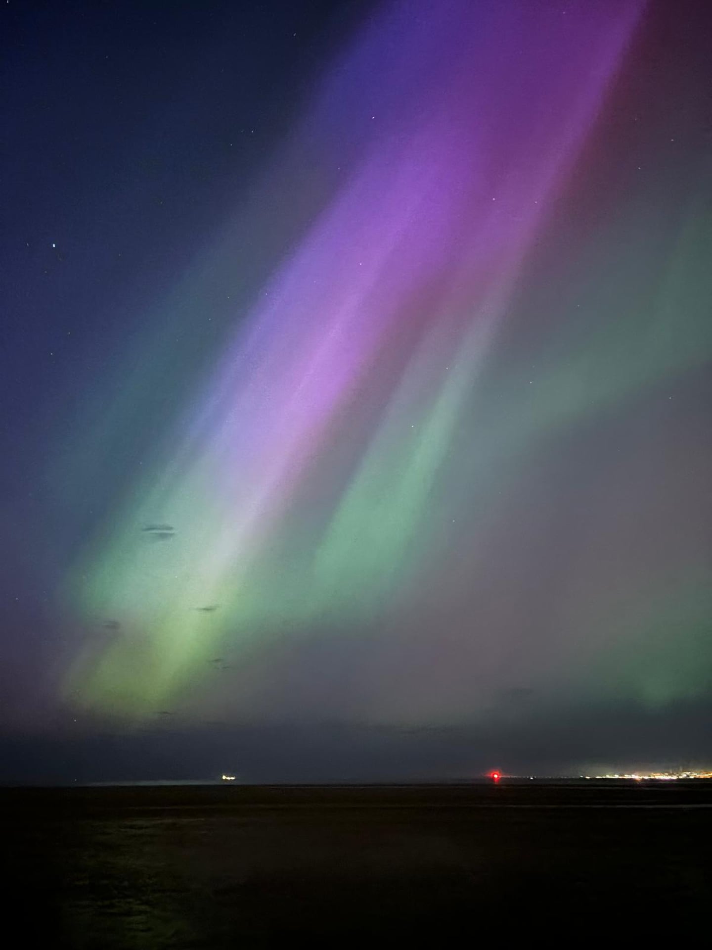 The Northern Lights over Dollymount Strand in Dublin on Friday. Photograph: Kitty Holland