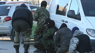 Russian troops smash their way into Ukrainian base in Crimea