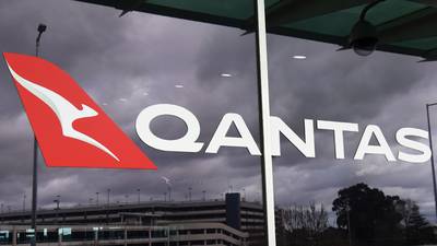 Qantas cuts more jobs and starts selling pyjamas