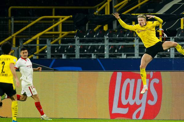 Haaland double sees Dortmund through despite Sevilla fightback
