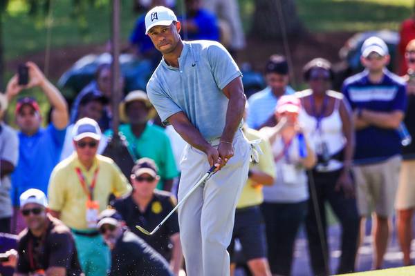 Tiger Woods birdies the last to share halfway lead at East Lake