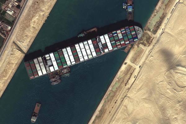 Stranded vessel leaves nearly 400 ships waiting to transit Suez Canal
