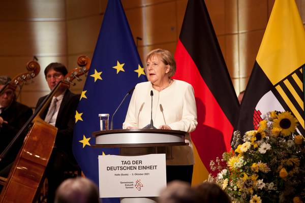 Merkel urges greater respect for sacrifices of eastern Germans