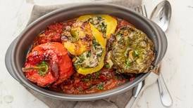 Spinach and mushroom stuffed bell peppers in a tomato and tarragon sauce