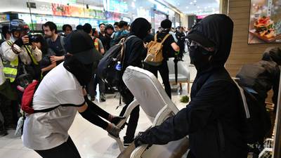 Hong Kong: Violence spills on to streets after arrest of politicians