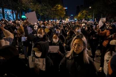 Covid-19 cases in China hit new record high after weekend of protests