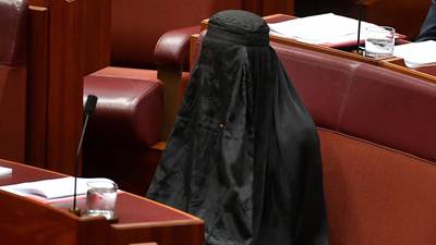 Australian senator rebuked for wearing burka to parliament