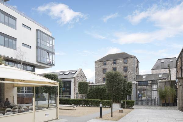 Quirky office scheme of modern and retro-fitted cut-stone warehouses