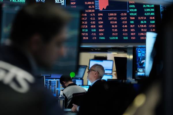 European stock markets inch down after central banks hike rates