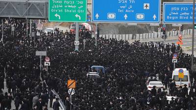 Thousands flout Israel’s Covid-19 restrictions to attend rabbi’s funeral