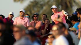 Rory McIlroy closing in on lead in Dubai as play suspended