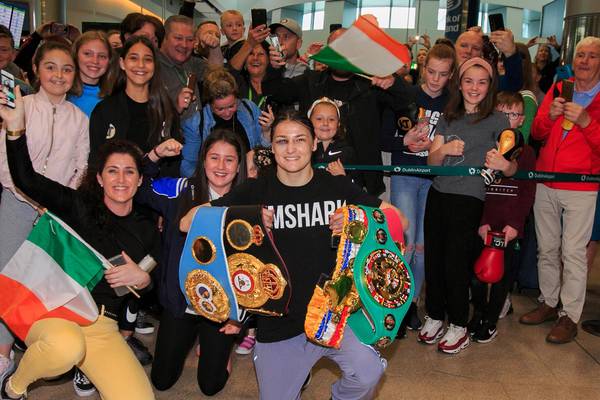Katie Taylor arrives home after fight to displays of devotion