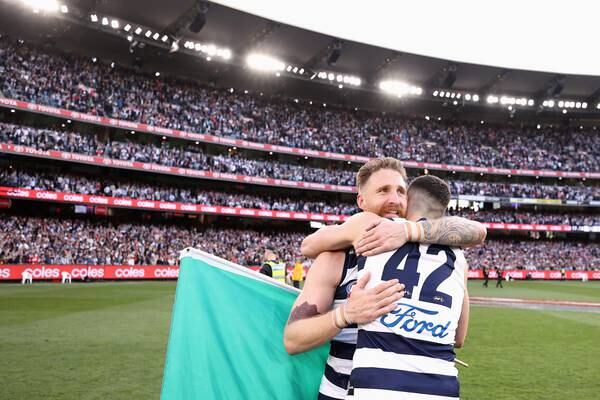Tuohy and O’Connor celebrate as Geelong rout Sydney in AFL Grand Final