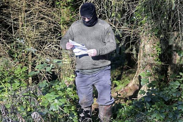 PSNI examine photo of masked man reading QIH death threat