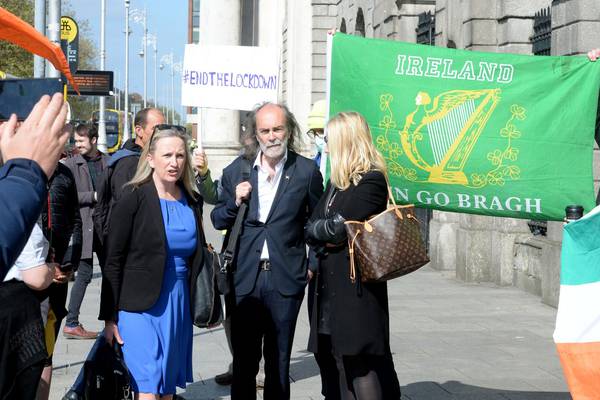 Crowd of Gemma O’Doherty and John Waters supporters gather at court