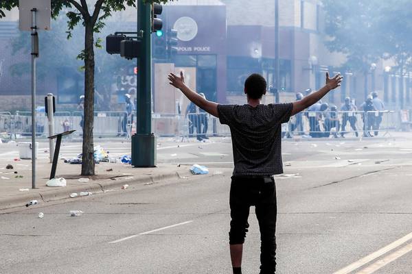 George Floyd death: Protesters and riot police clash in Minneapolis