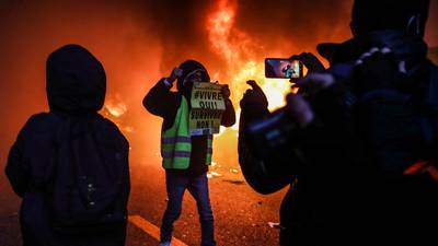 Clashes break out at Paris protest against Macron’s security law