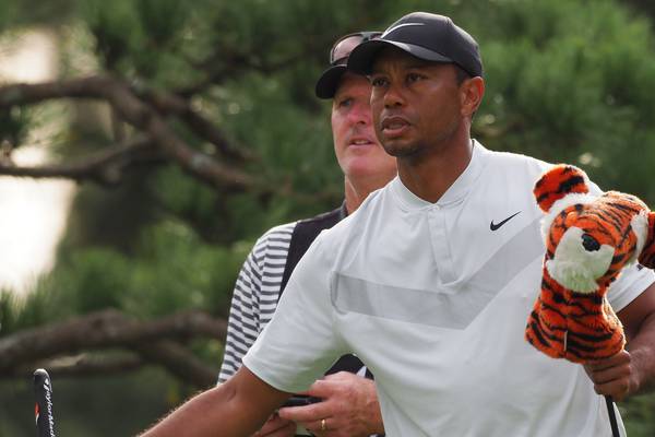 Tiger Woods leads in Japan after second round of 64