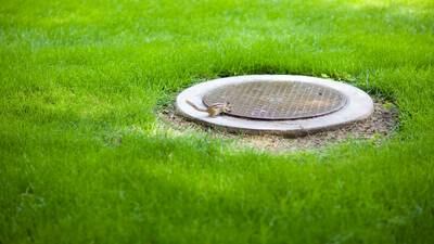 Can I cover the unsightly manholes in my garden?