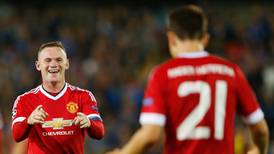 Rooney hat-trick sends United into Champions League