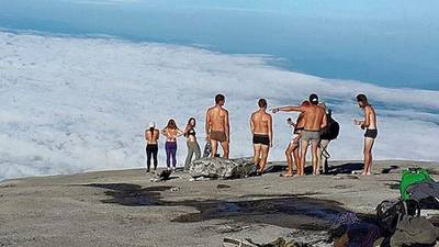 Arrested tourist ‘sorry’ after naked photo on sacred  mountain