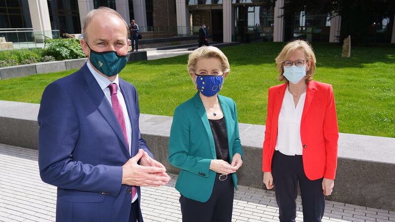 An Taoiseach, Micheál Martin, greets European Commission president, Ursula von der Leyen, and commissioner Mairead McGuinness during their visit to Dublin in July 2021
