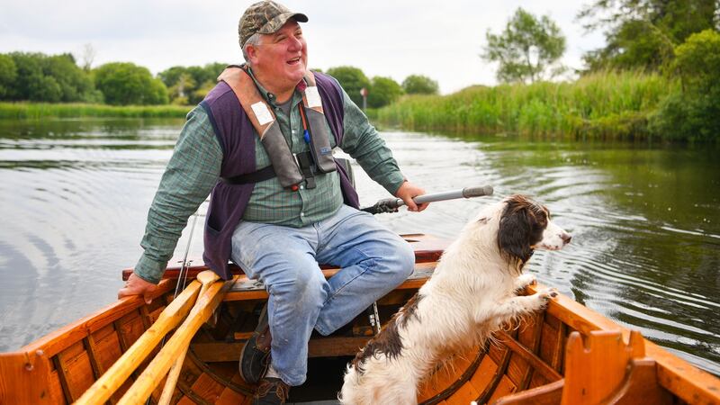 Eamonn Giblin takes a fishing trip with his dog Tina on Lough Derg near his home in Scarriff, Co Clare. Photograph: Diarmuid Greene