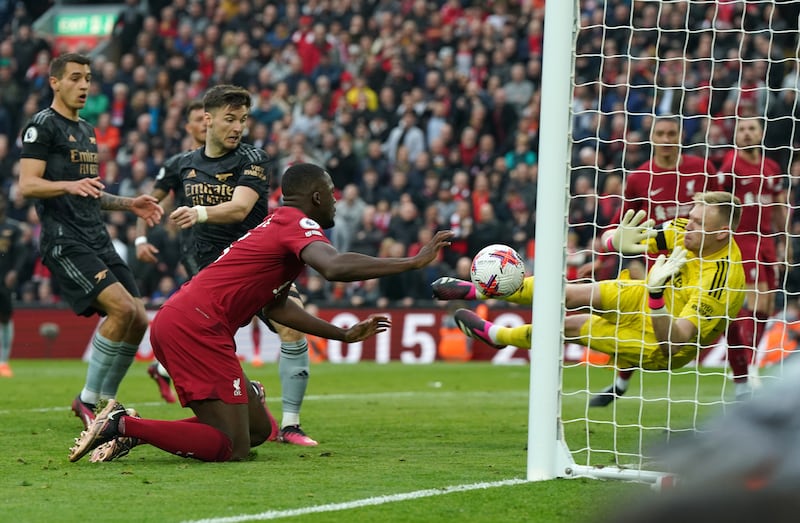 Arsenal goalkeeper Aaron Ramsdale saves from Liverpool's Ibrahima Konate late in the game during the Premier League match at Anfield, Liverpool.