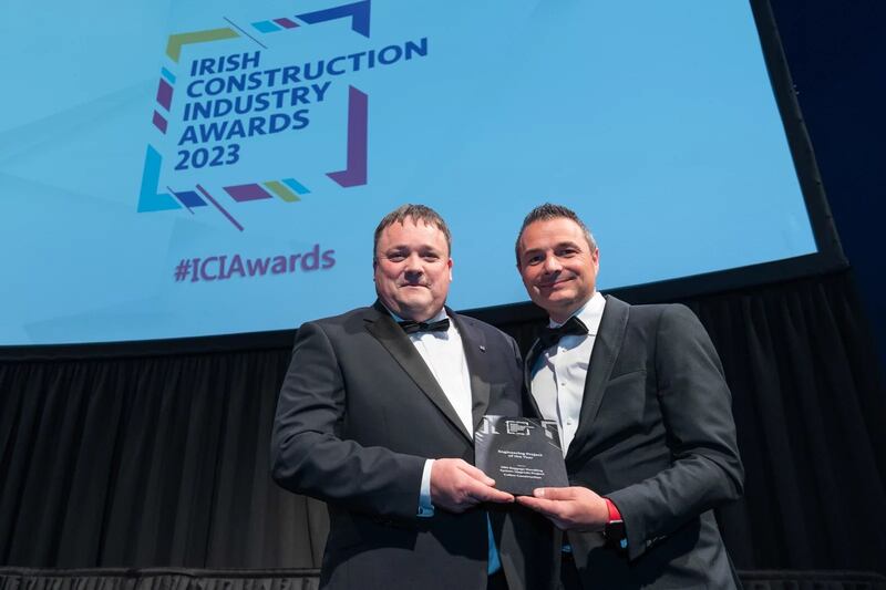 Mark Poveda, managing director at KOREC Ireland, presents the engineering project of the year award to David Lee, Collen Construction