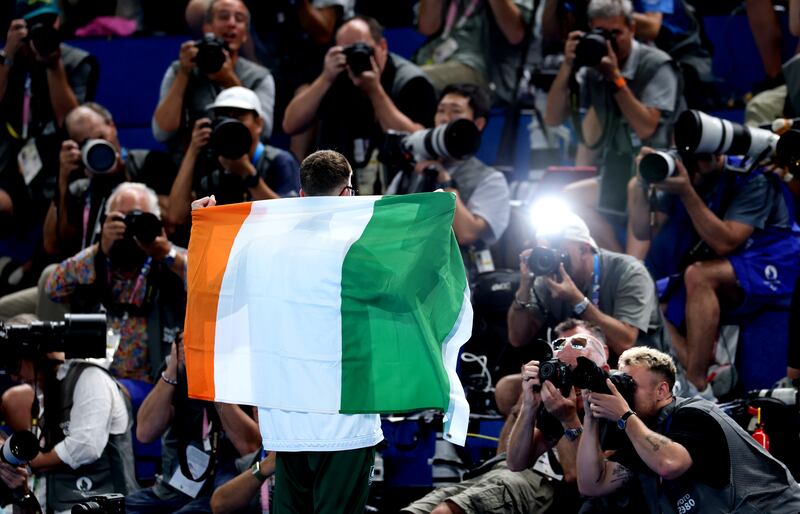 Daniel Wiffen is the centre of attention as he celebrates winning gold in the 800m freestyle final in Paris. Photograph: James Crombie/Inpho 