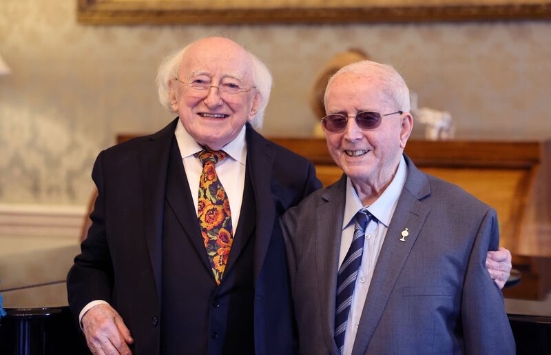 President Michael D Higgins with Charlie O'Leary, a 101-year-old former physio, at Áras an Uachtaráin. Photograph: Dara Mac Dónaill