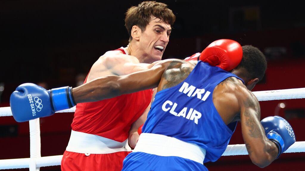 Aidan Walsh   in action with Merven Clair   of Mauritius in the men’s welterweight quarter-finals. Photograph: James Crombie/Inpho