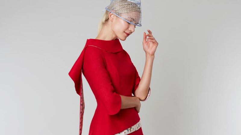 Frill – tailored top with raised collar and asymmetrical hem with contrasting floral silk print worn here with tailored trousers. It can also be made with a tailored mid-calf or full-length skirt in a range of fabrics and colours, approx €1,600.
