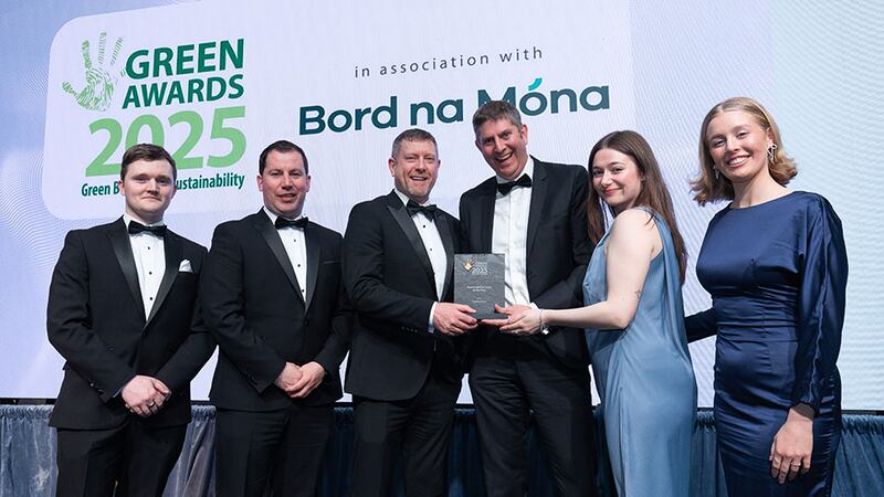 Duncan Osborne, CEO, presents sustainability team of the year to the Astellas Kerry team