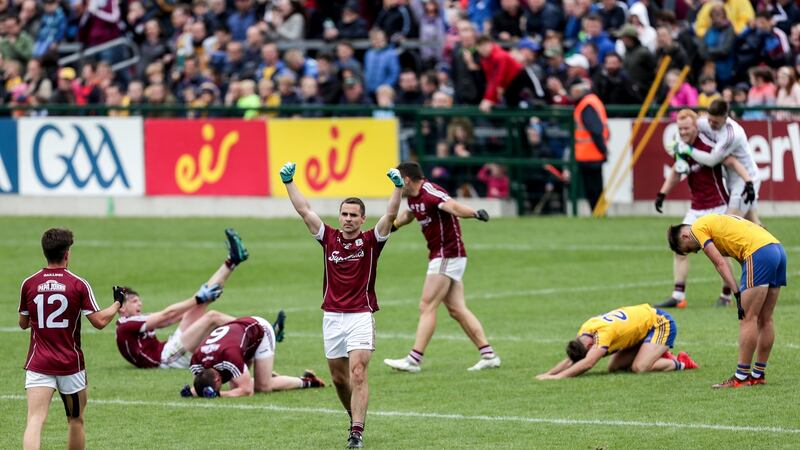 Galway players celebrate at the final whistle after beating Roscommon. Photo: Laszlo Geczo/Inpho