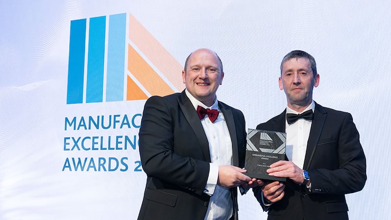 Dr Emmett Kerr, committee member at Irish Manufacturing Council, presents the operational excellence award to Donogh McCarthy, Viatris Little Island
